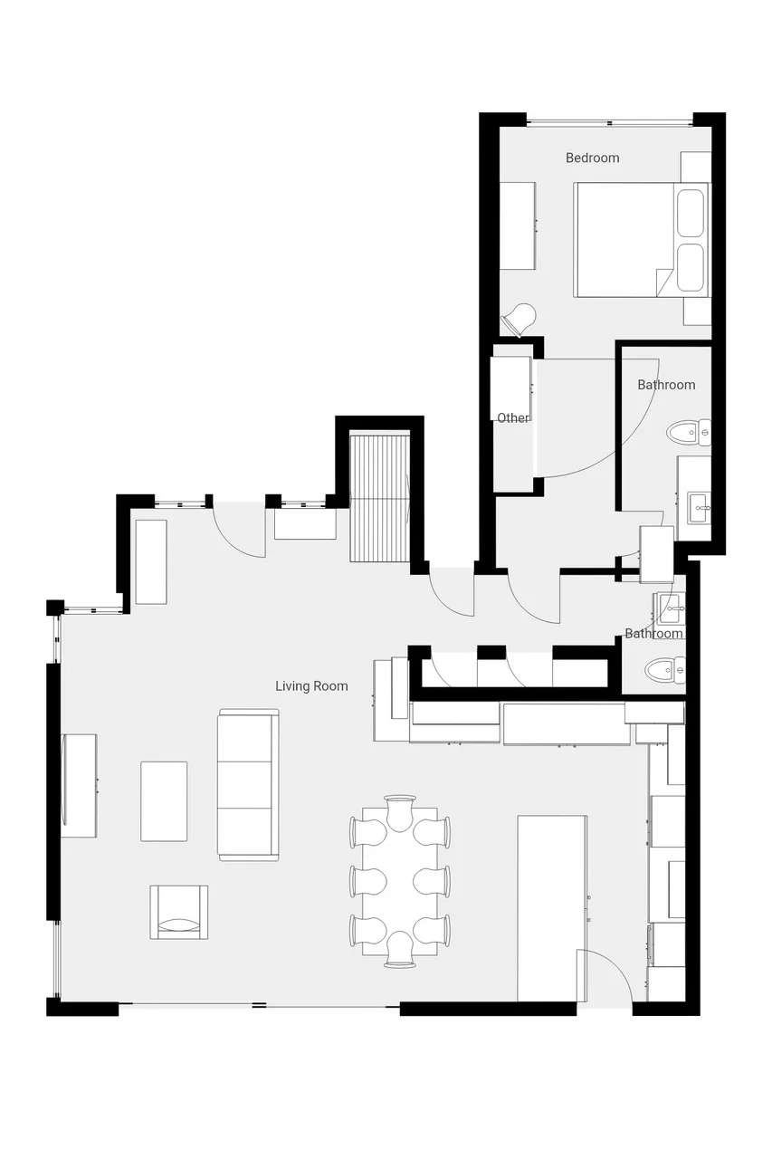 Un plano muestra una sala de estar, comedor, dormitorio, cocina y baños.