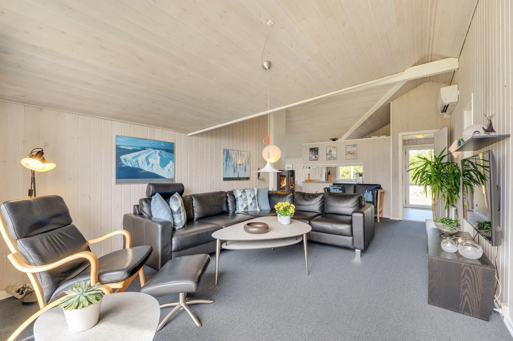 A bright living room with seating arranged around a coffee table.
