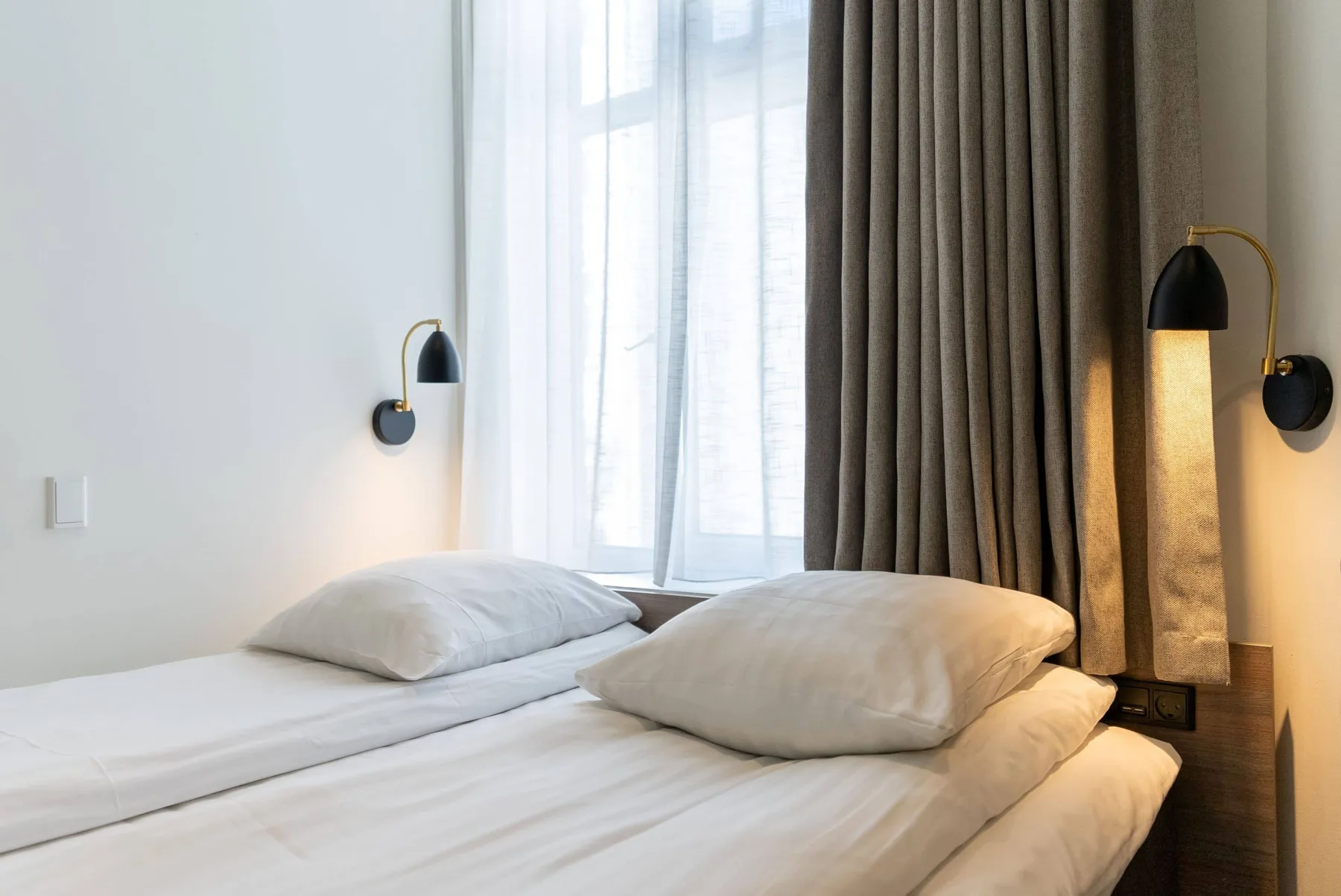 Close view of a double bed in a hotel room.
