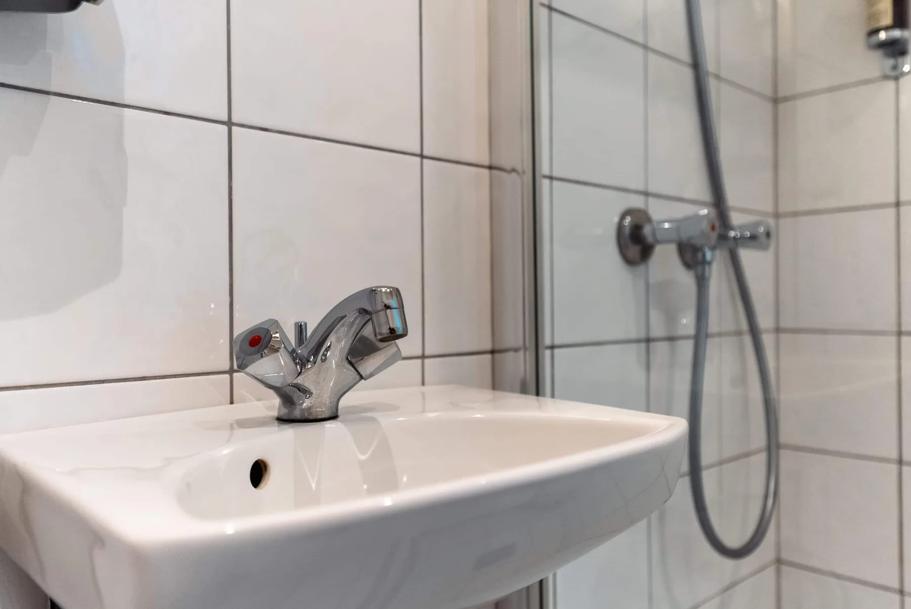 Bathroom sink and shower.