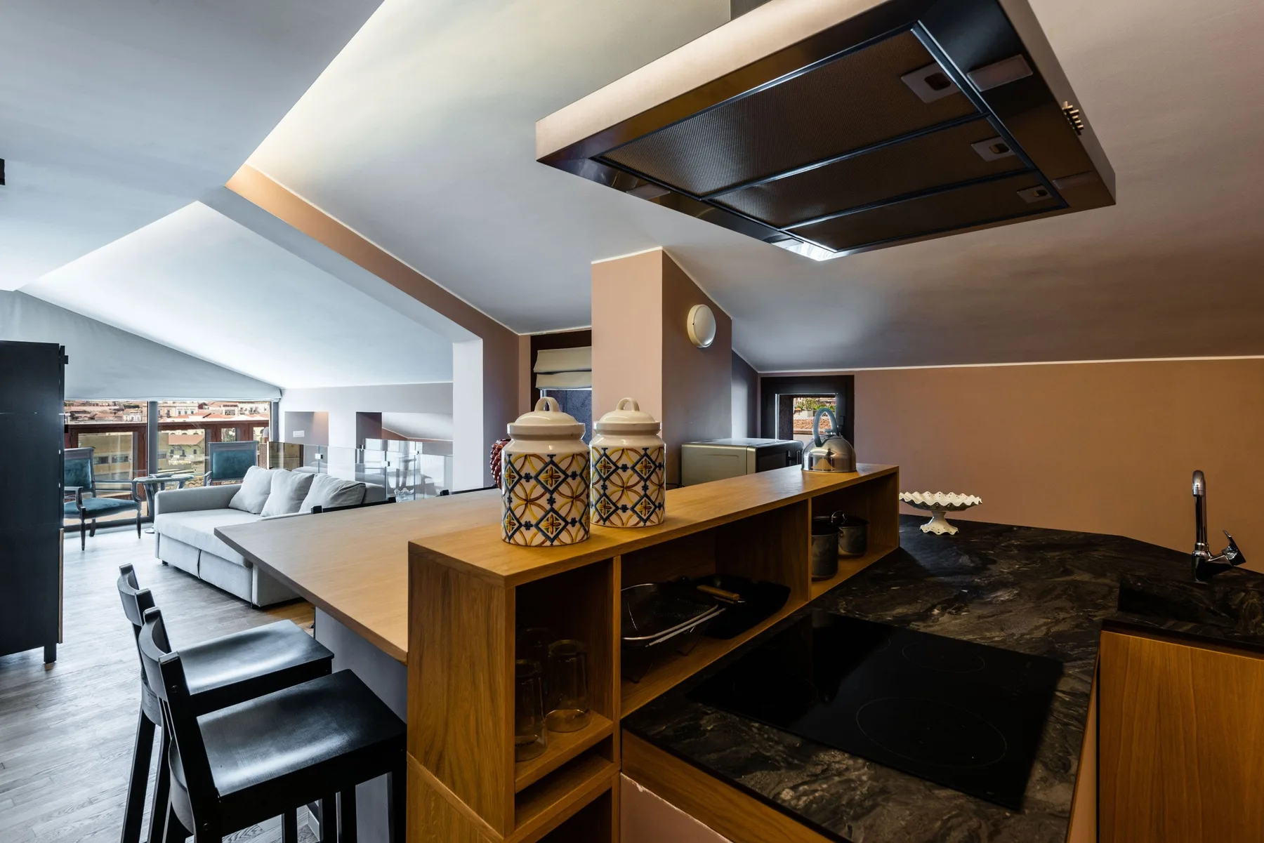 An open-plan kitchen and dining area with a long island and bar seating.