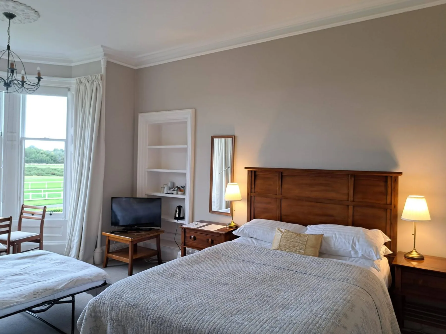Standard double room with shared shower room and extra sofa bed