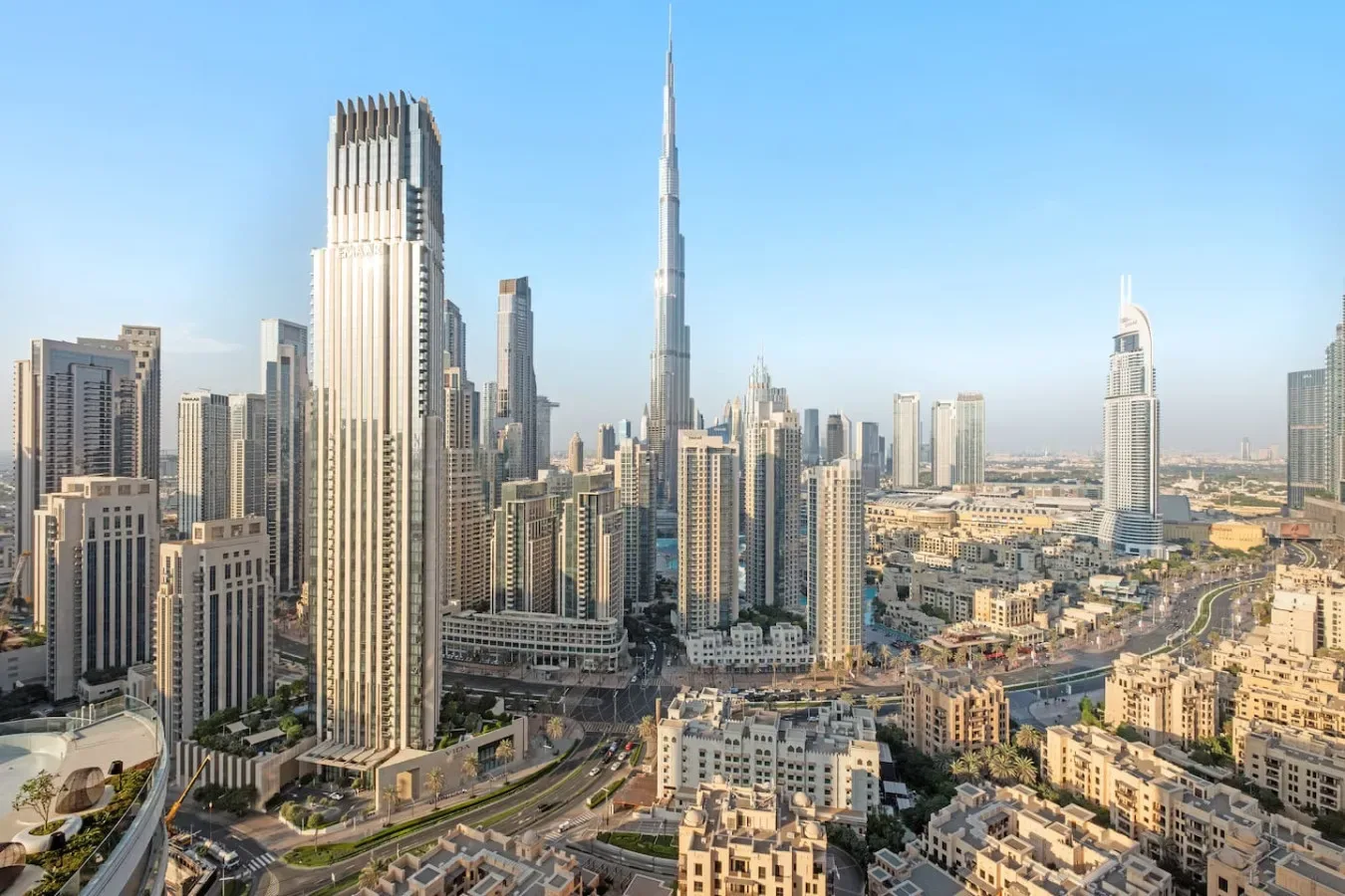 A city skyline with tall skyscrapers and roads in the foreground.