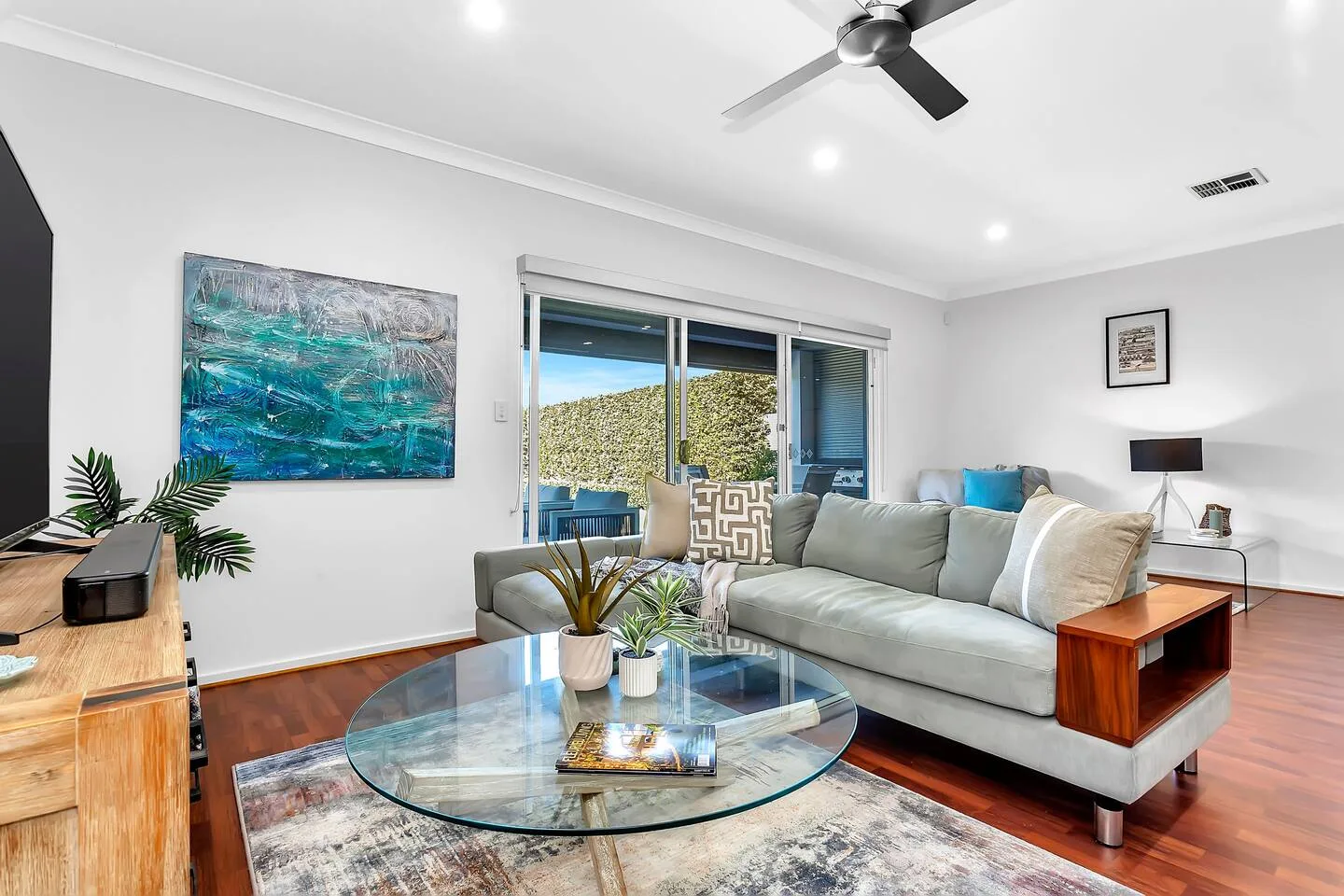 Settle into the light-filled living area, where comfortable seating and calm styling make it easy to slow down after a day out.