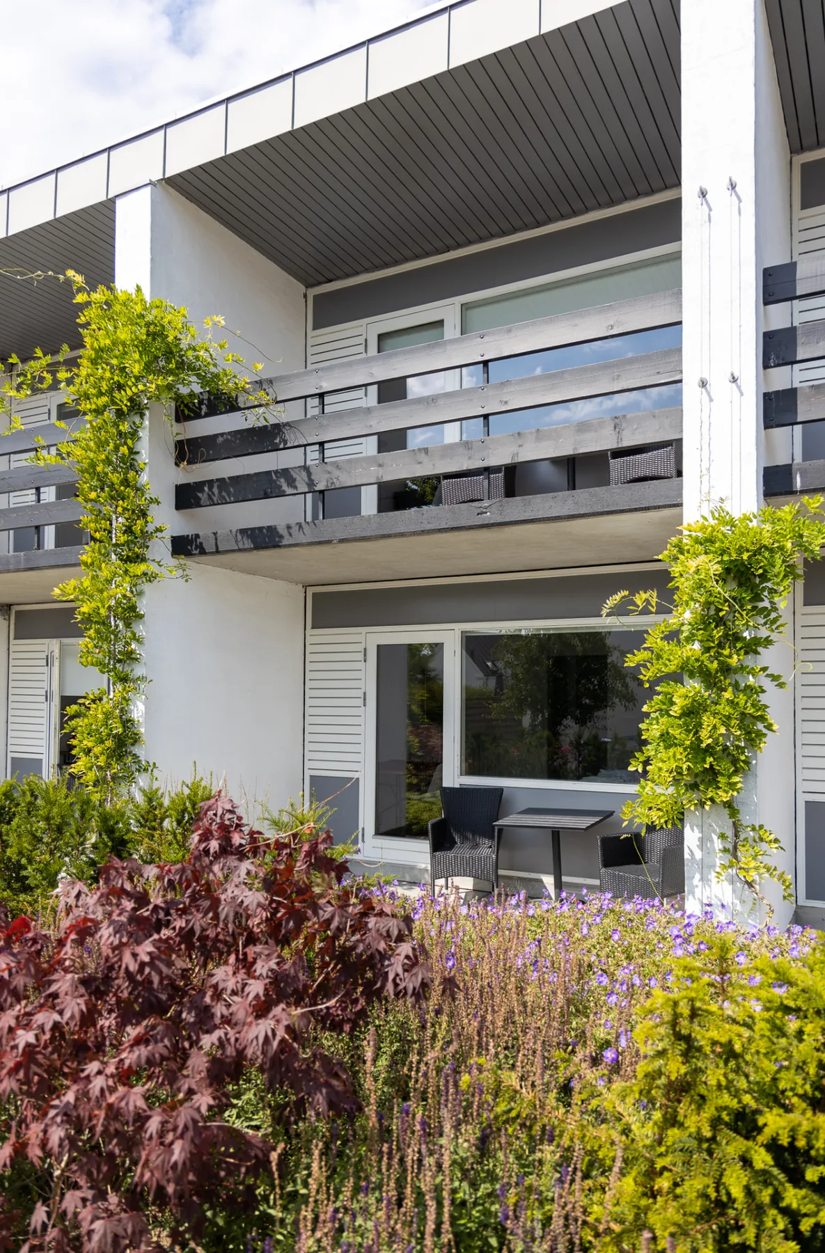 Room with balcony and garden
