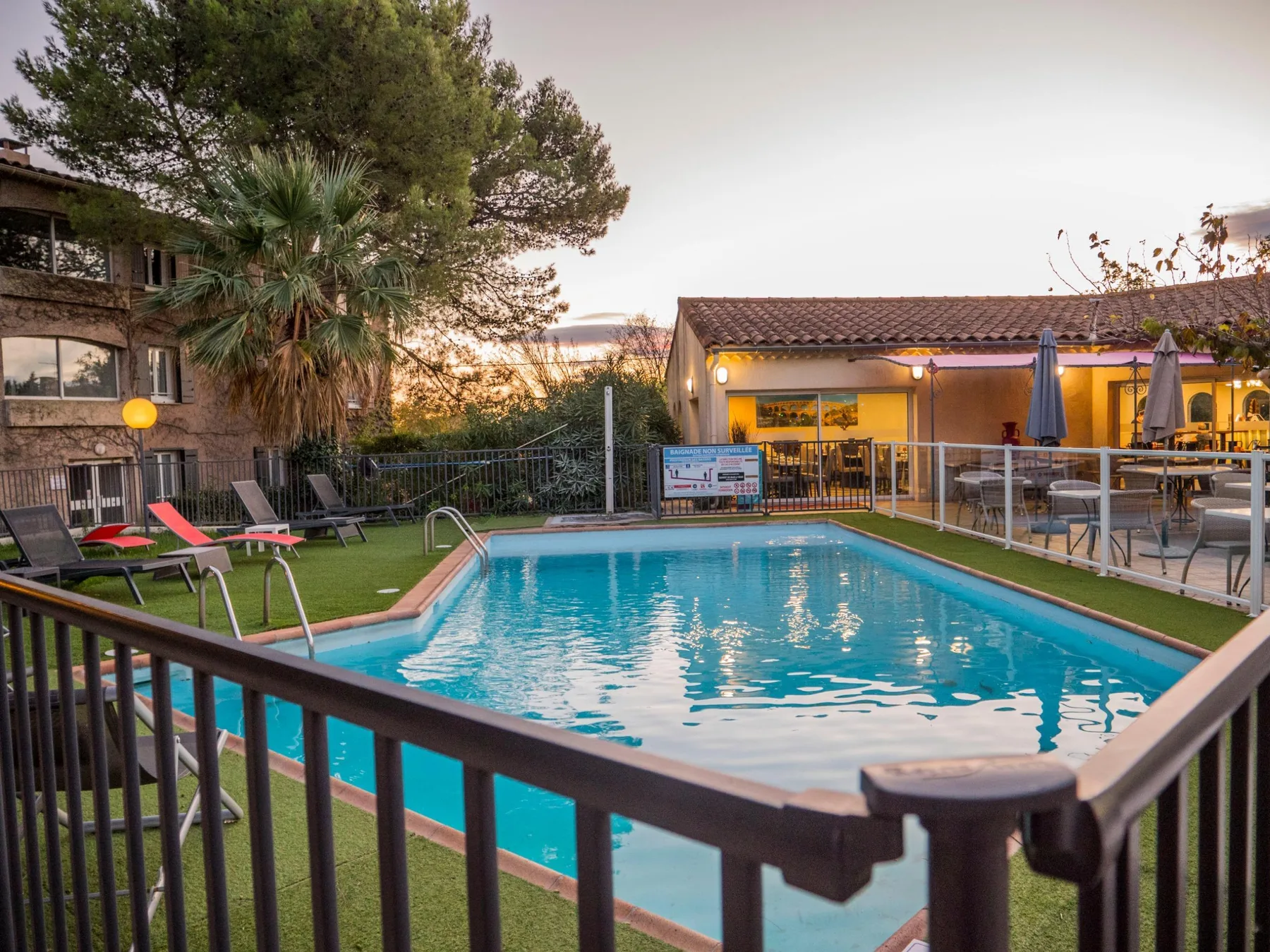 Poolside and hotel exterior