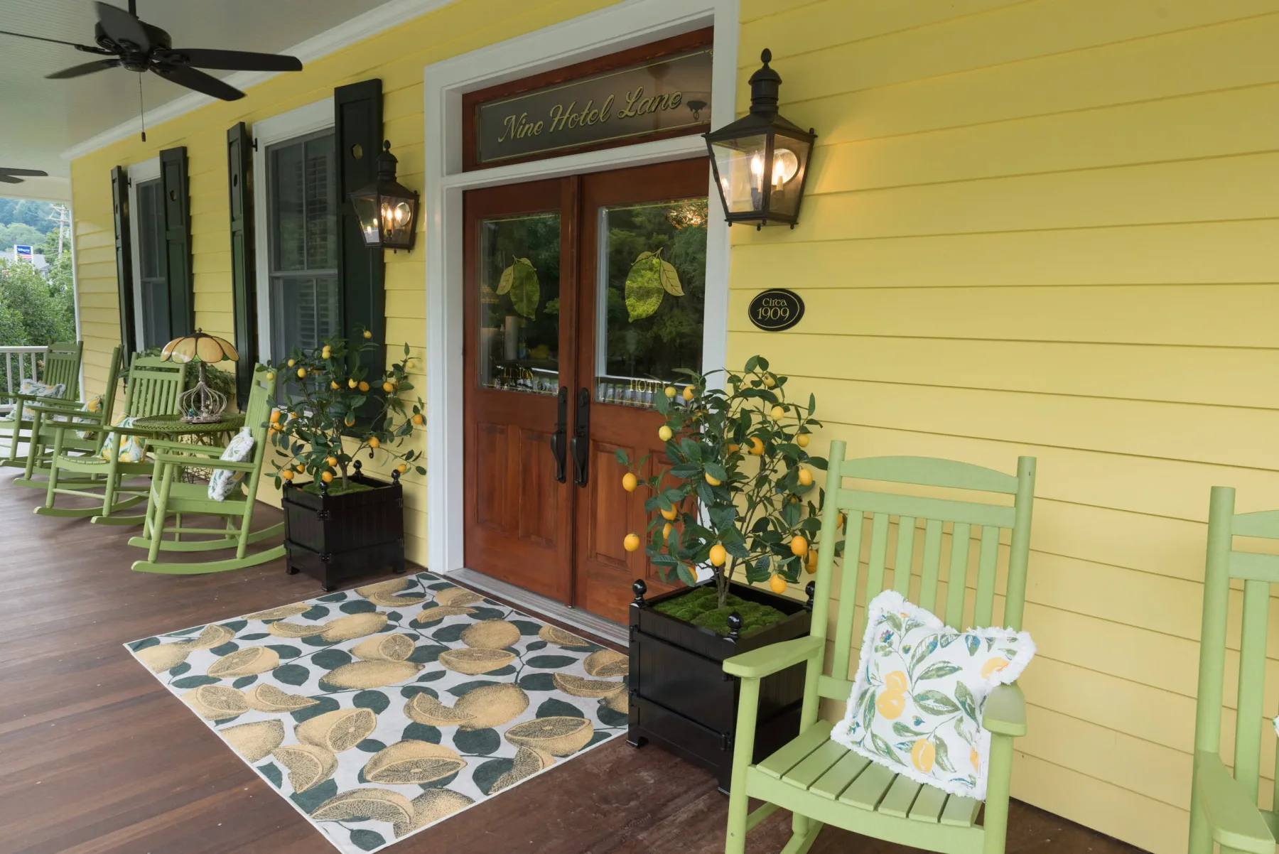 Covered front porch with rocking chairs.