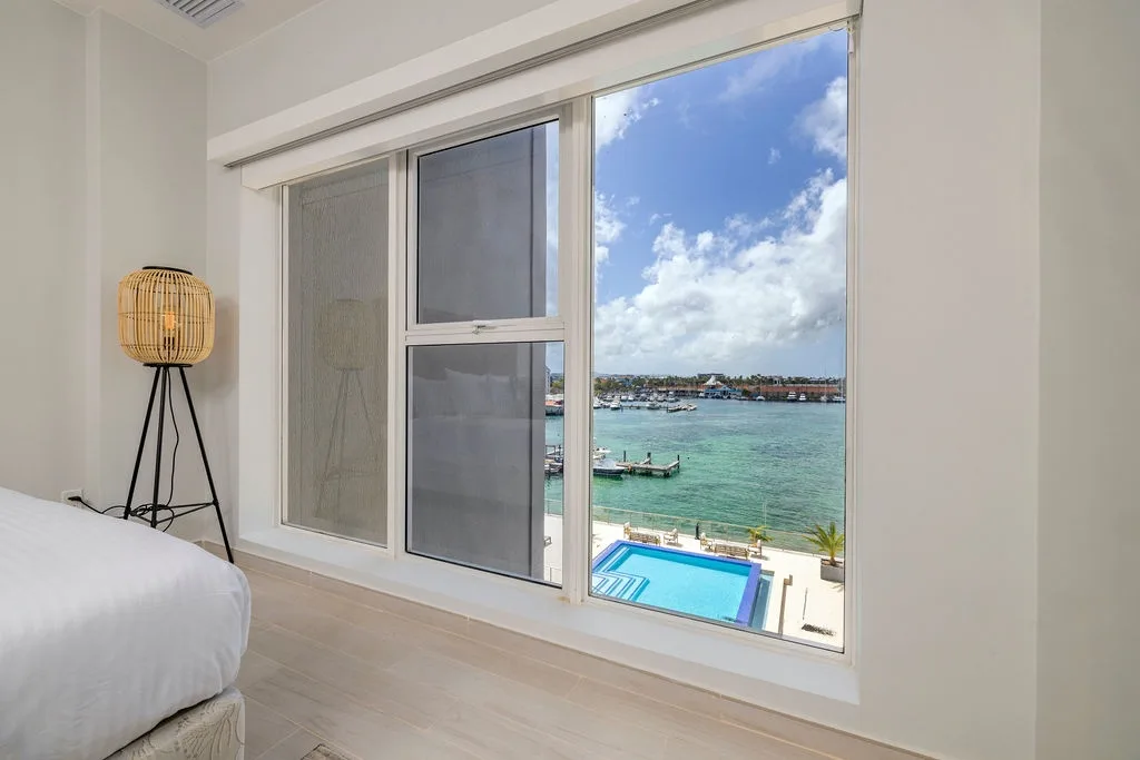 Natural light fills the space, inviting you to unwind with stunning coastal scenery.
