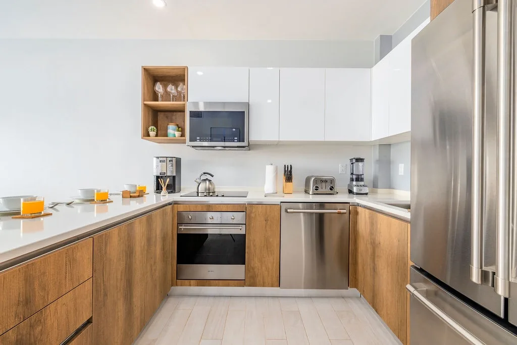 Your fully equipped kitchen features modern stainless appliances, ample counter space