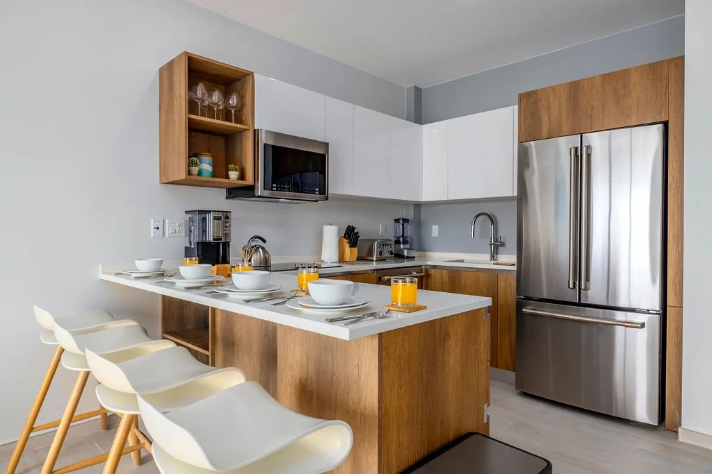 Gather around the sleek breakfast island in your fully equipped kitchen
