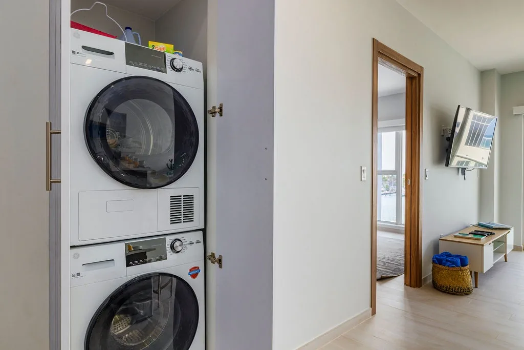 Your laundry needs are covered with convenient in-unit washer and dryer, tucked neatly in a hallway closet for easy access.