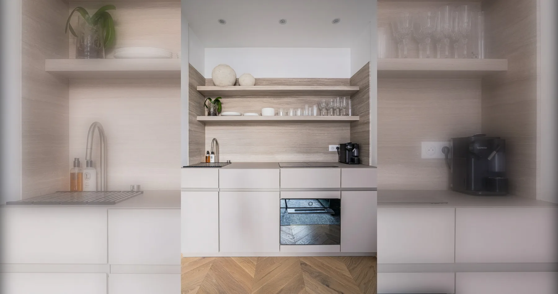 A modern kitchen with open shelves and a built-in oven.