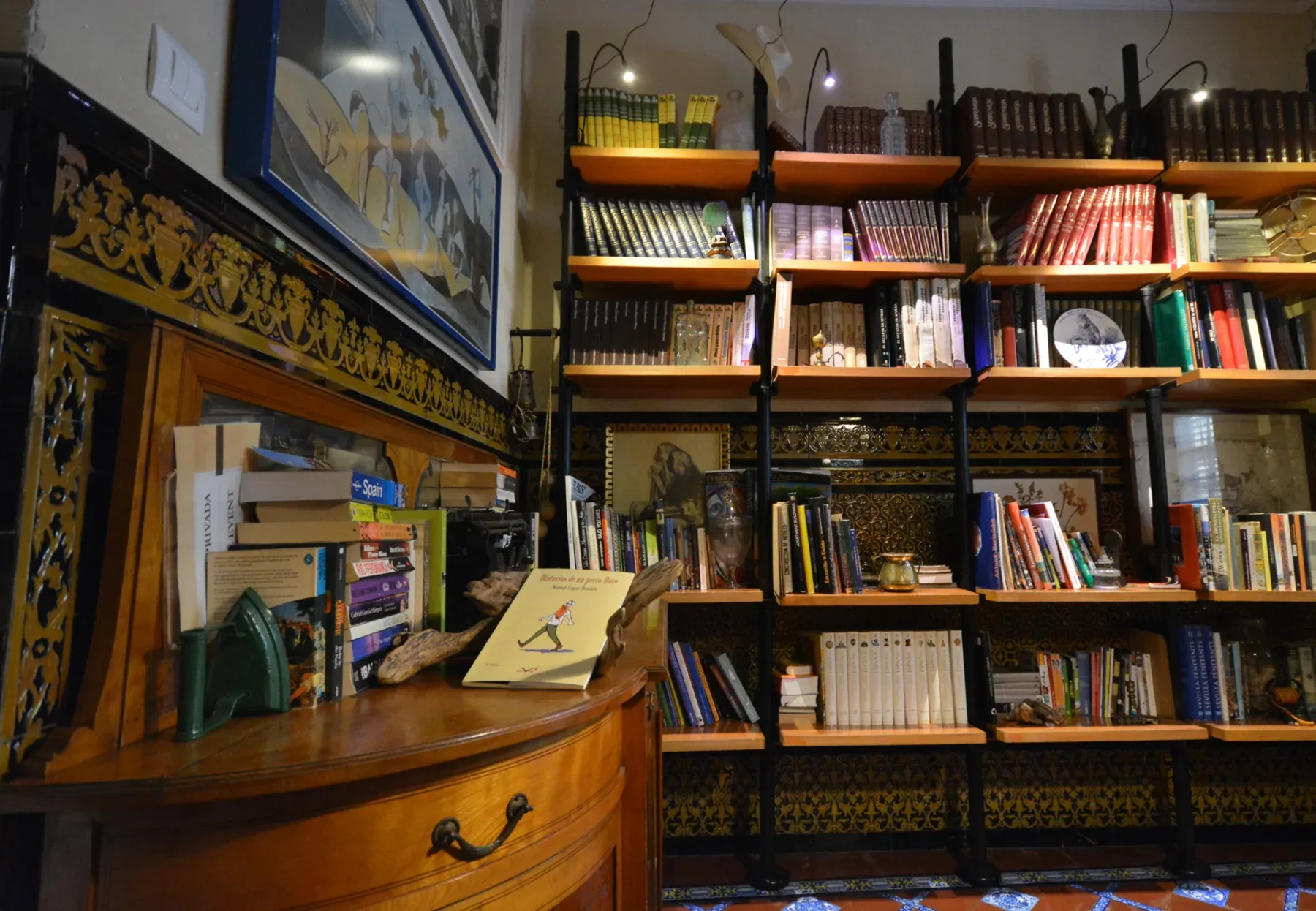 Hotel library with shelves and artisan-style decor