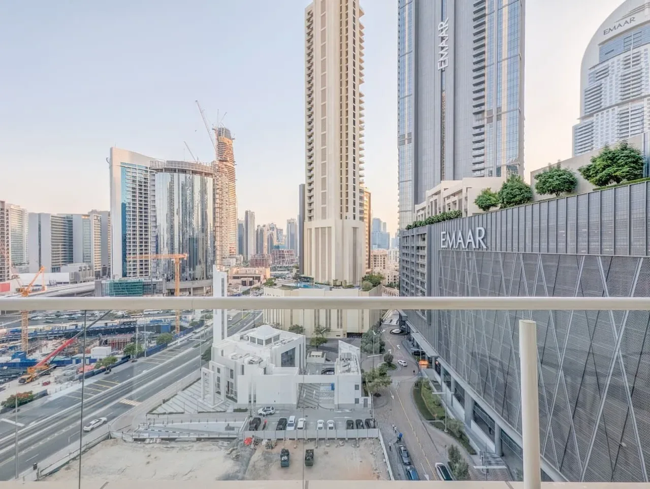 A city skyline of modern high-rise buildings viewed from an elevated terrace.