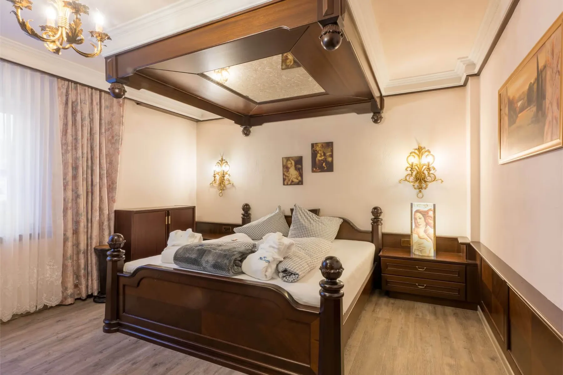 Holiday apartment bedroom with exposed wooden ceiling