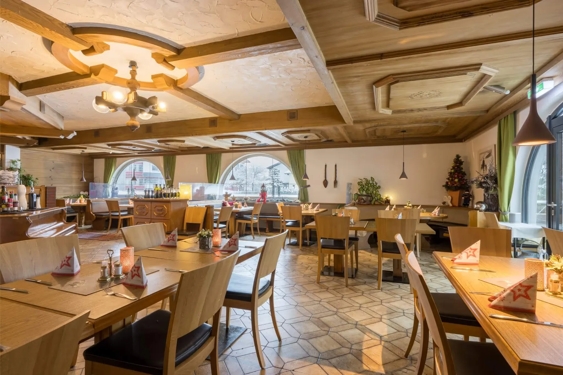 Dining room with wooden furnishings and round windows