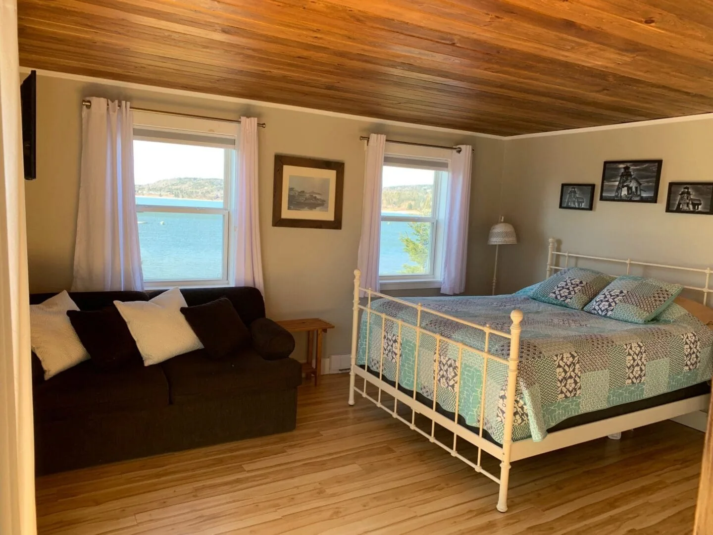 Bedroom with ocean views and natural light.