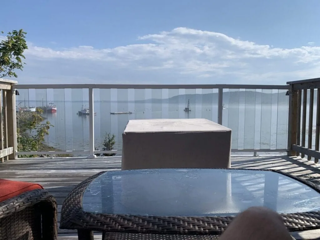 Deck overlooking the water and boats.