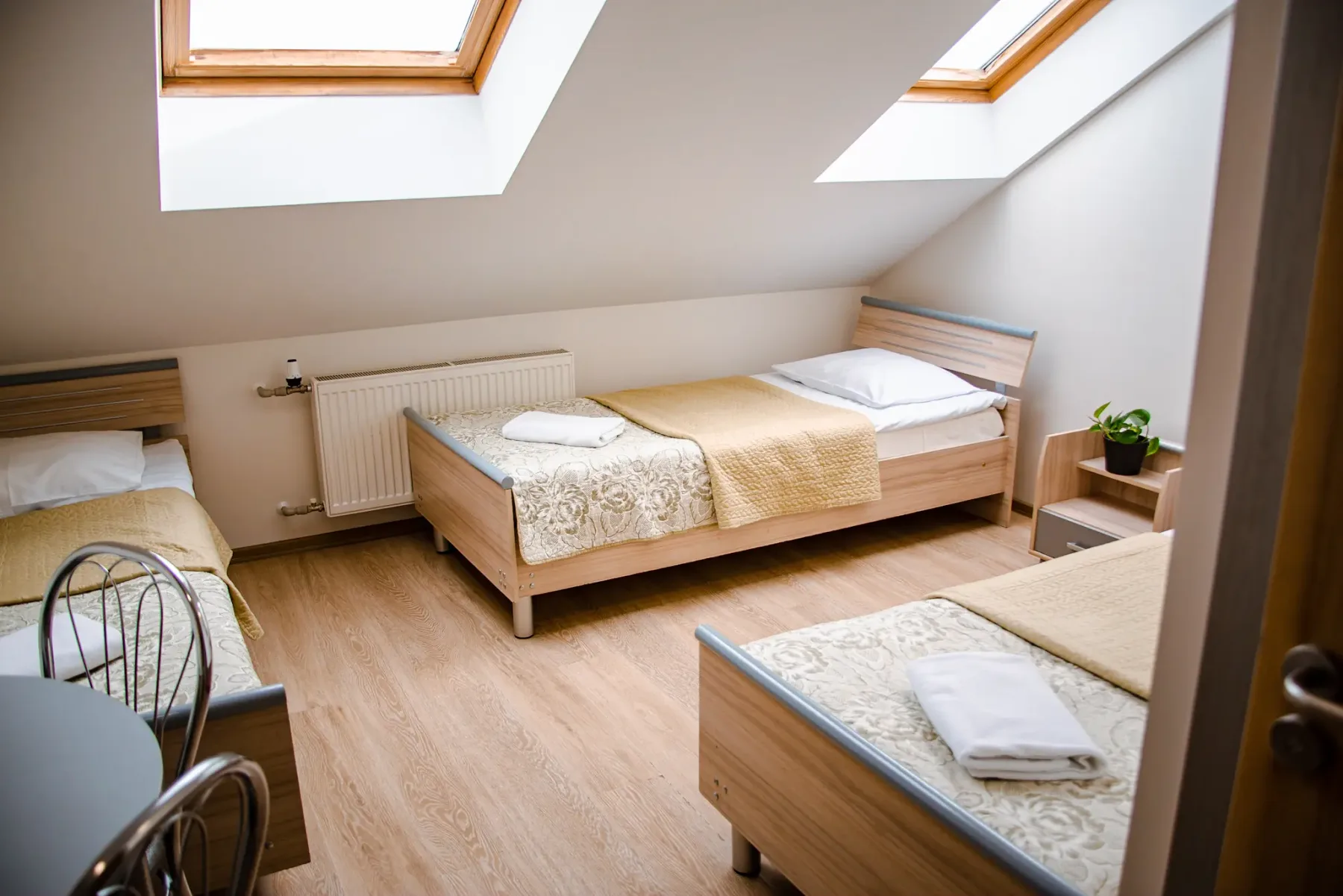 Room with three separate single beds