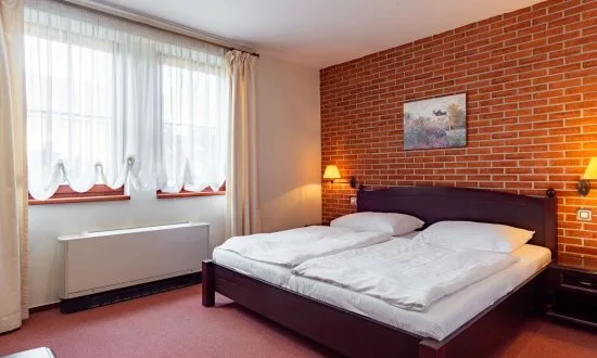 Superior double room with double bed and bathtub