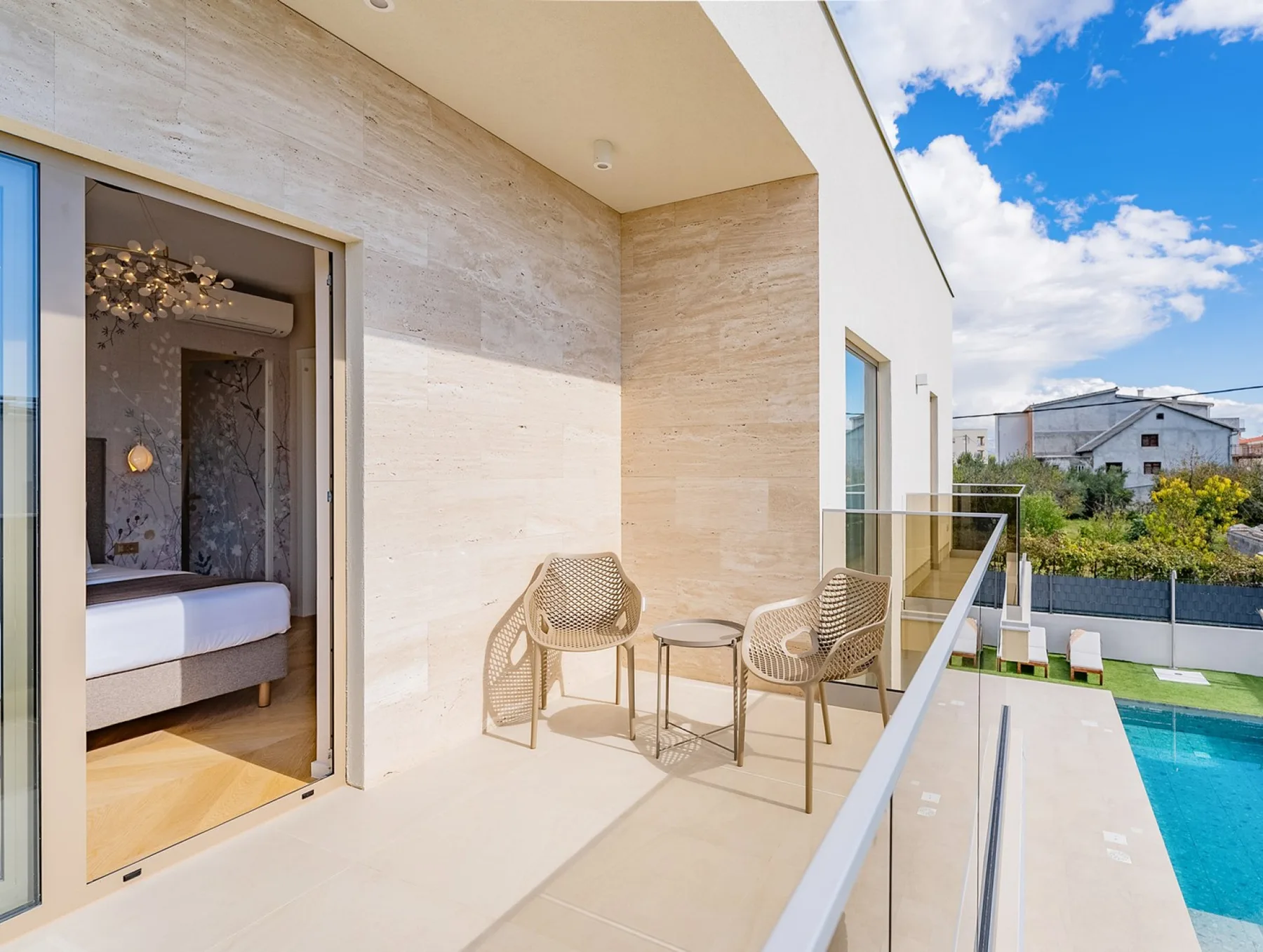 Master bedroom No1 also offers a terrace with patio furniture and pool views