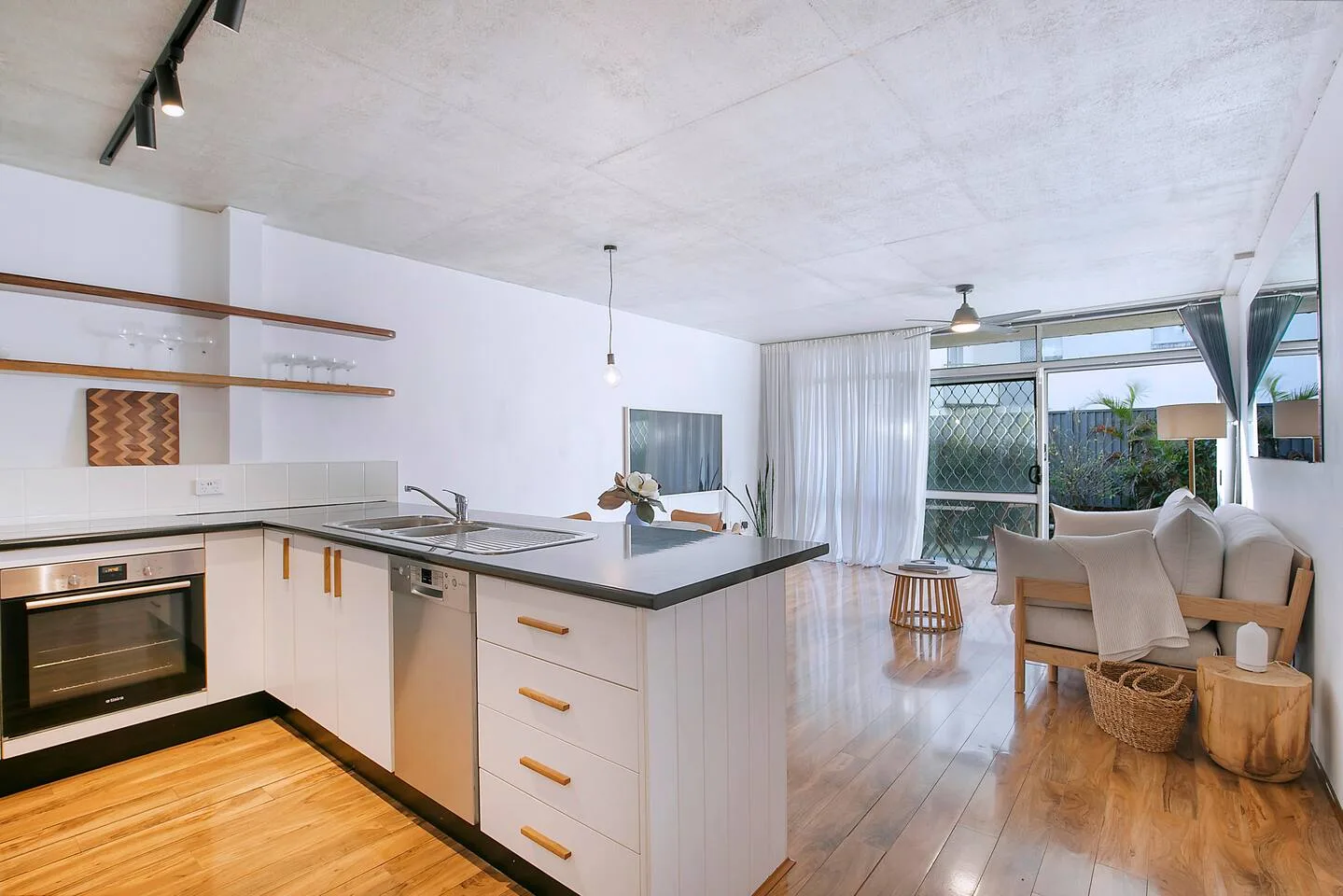 A seamless flow from kitchen to living invites easy connection and relaxation.