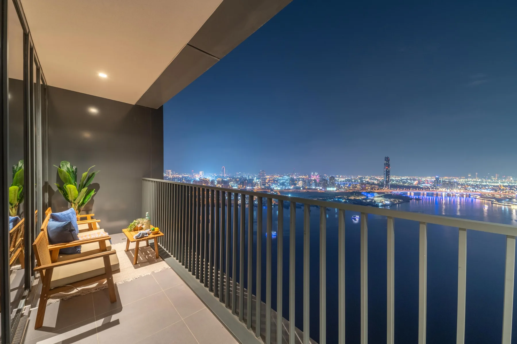Balcony w/ Creek Harbour & Skyline Views at Night