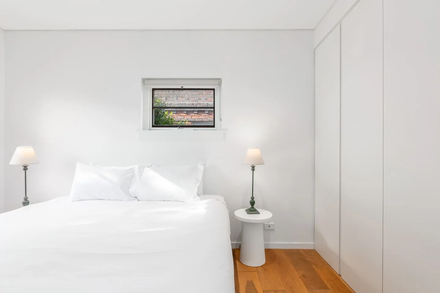 The light and airy first bedroom features a king-size bed and built-in robes.