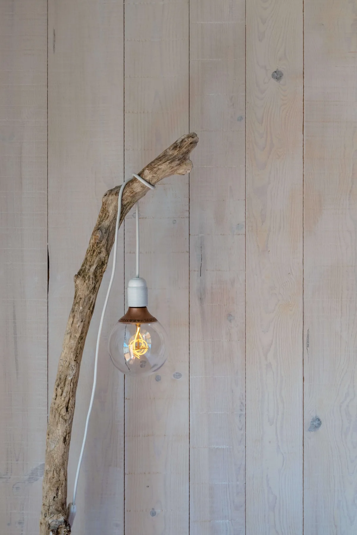 Wooden lamp made from recycled rural materials