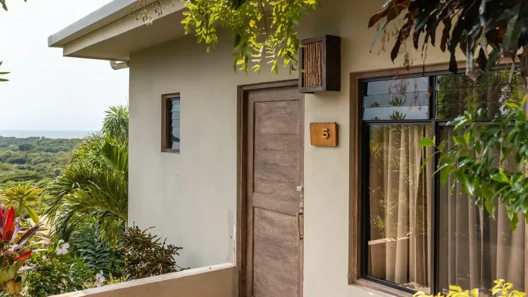 Entrance and balcony of a Double Queen Ocean View room