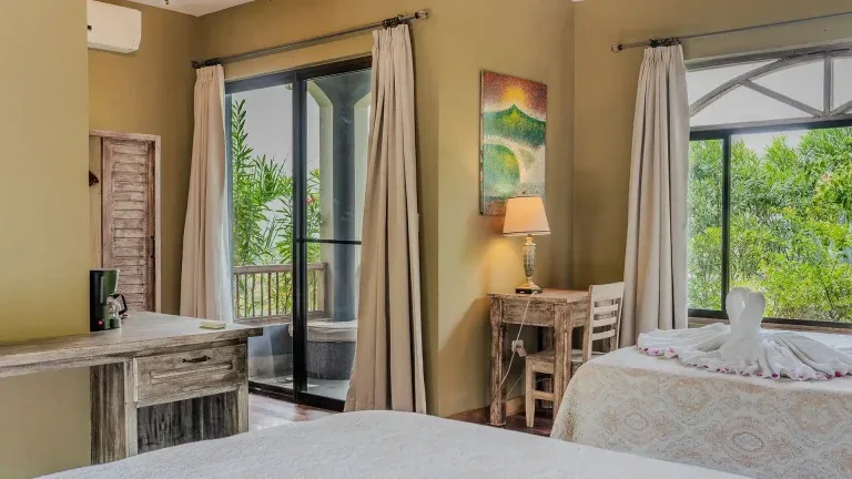 Double Queen Ocean View room with balcony doors