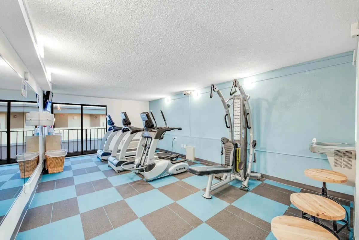 A gym with exercise machines and weight-training equipment.