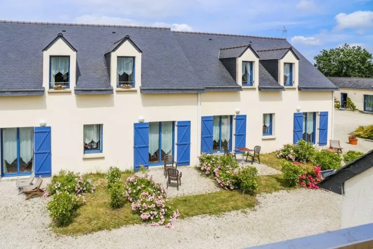 Hotel cottages with blue shutters