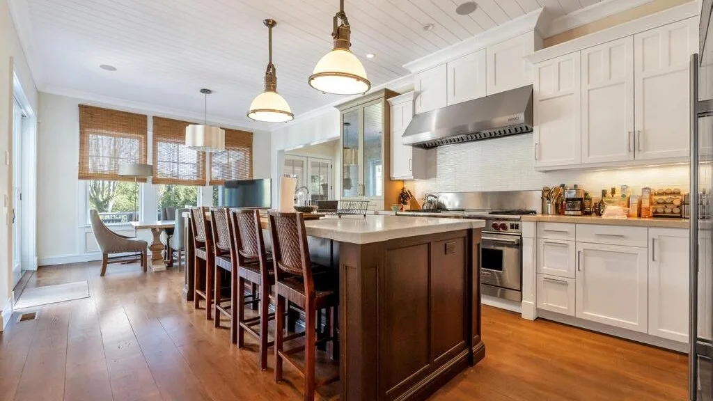 A bright kitchen with a large island and seating.
