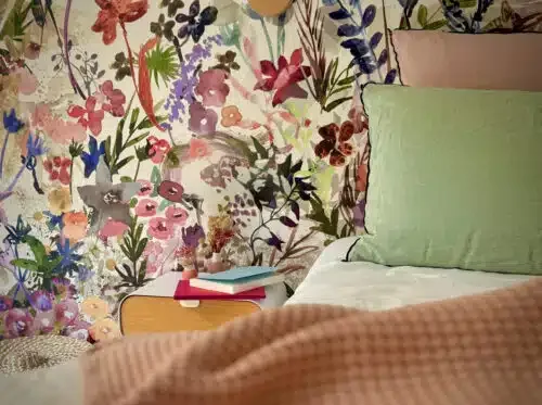 Guest room with bed and bedside table