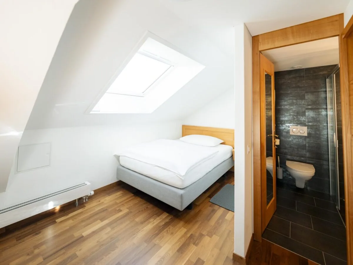 Comfort Single Room with a single bed beneath a skylight.