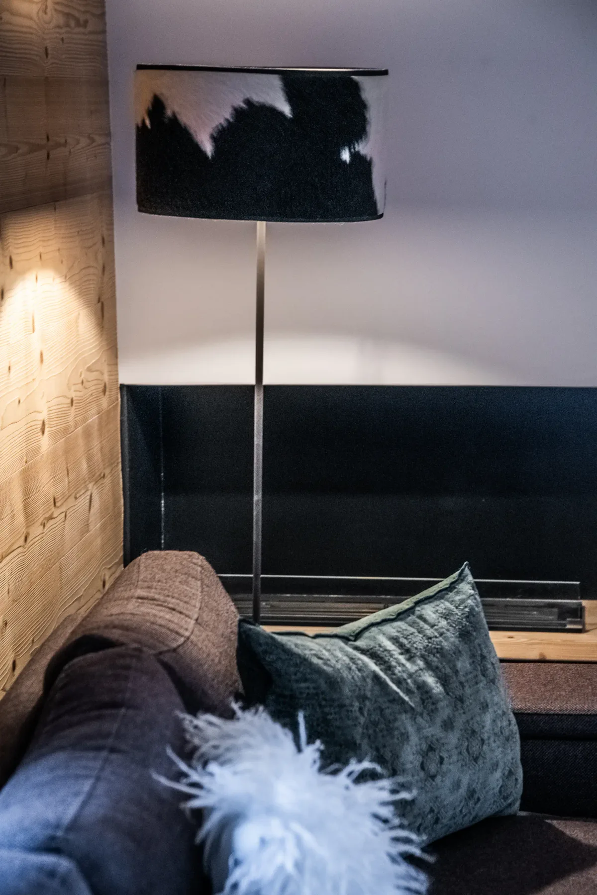 A living room seating area with a floor lamp beside the sofa.
