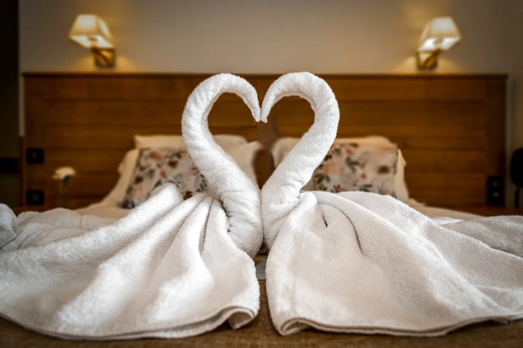 Decorative towels arranged on a hotel bed
