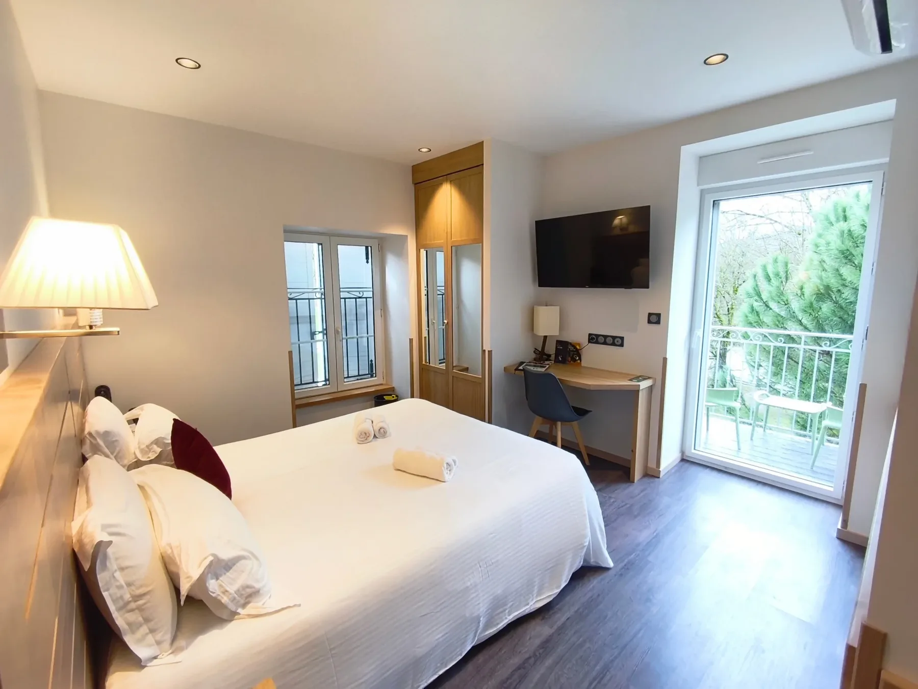 Modern hotel room with balcony and bed