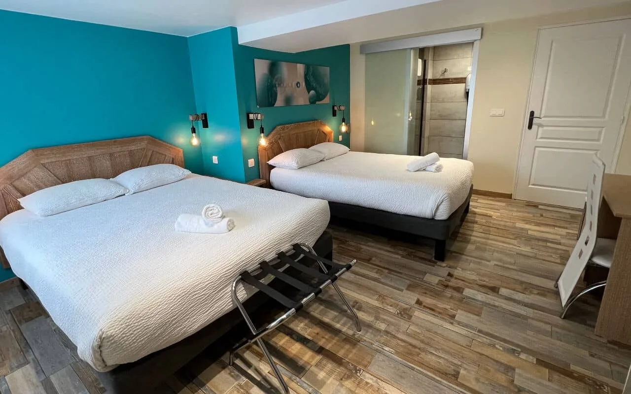 Comfort room with two beds