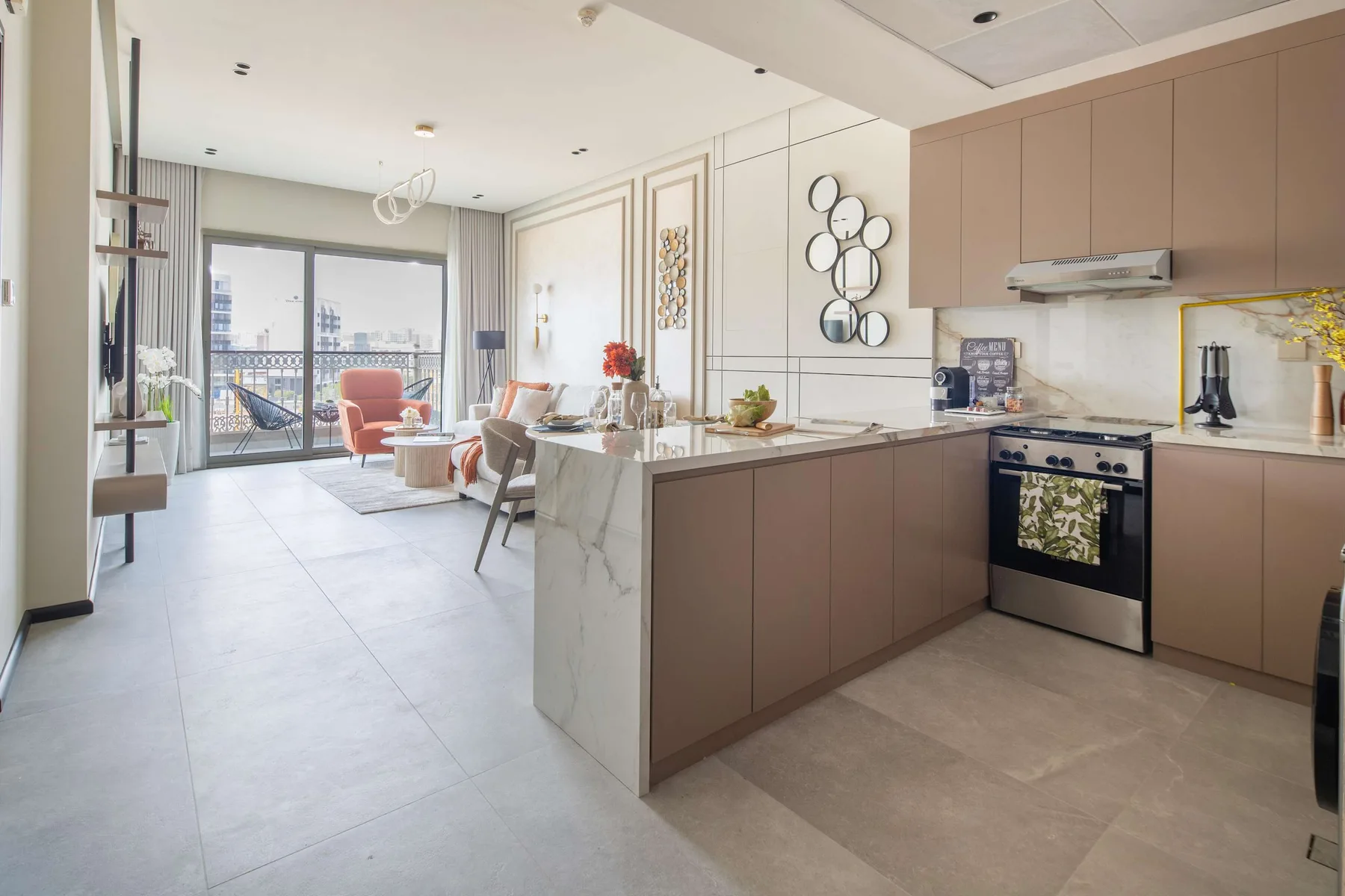 An open-plan kitchen and dining area with a peninsula counter and seating by the windows.