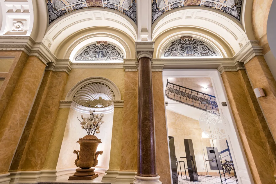 Lobby with frescoes and marble columns