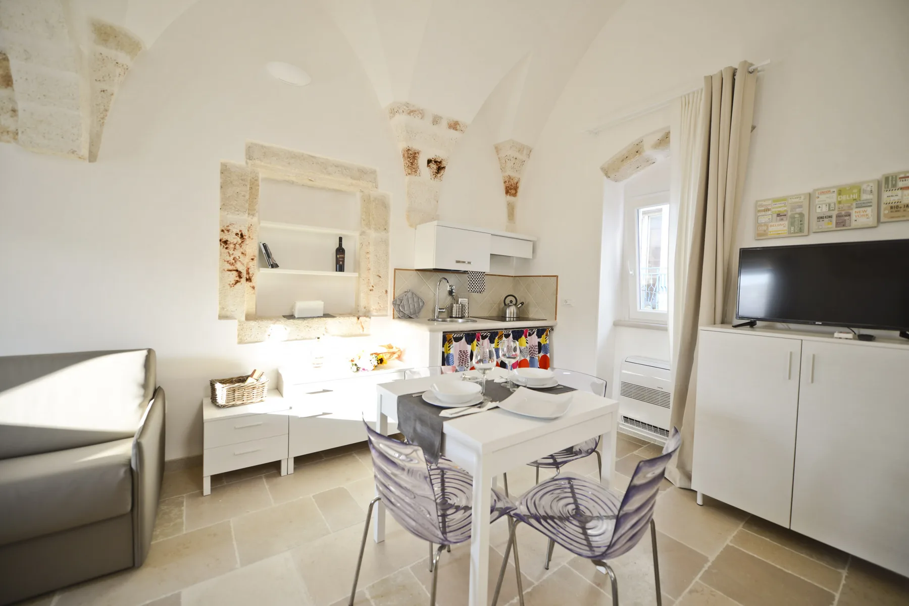 A bright kitchen and dining area with a table and chairs.