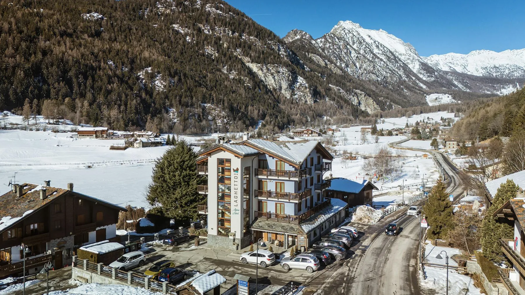 Hotel exterior and alpine setting