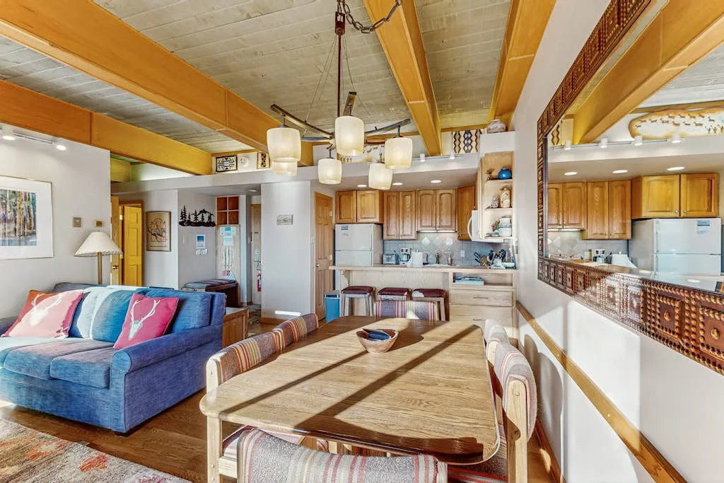 An open-plan living and dining area with a kitchen beyond.