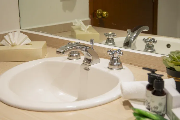 Sink and bathroom amenities in a Stanza Hotel single room