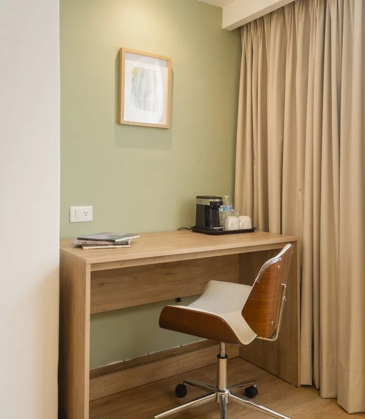Desk and coffee maker in a Stanza Hotel King room