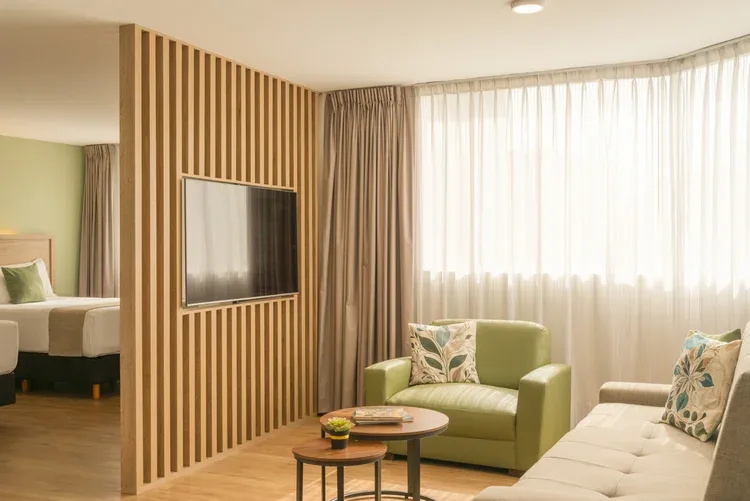 Stanza Hotel CDMX Double Suite with sitting area, television and two double beds