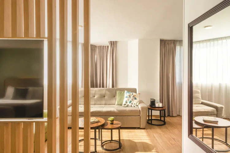 Stanza Hotel CDMX King Suite with sitting area and king bed