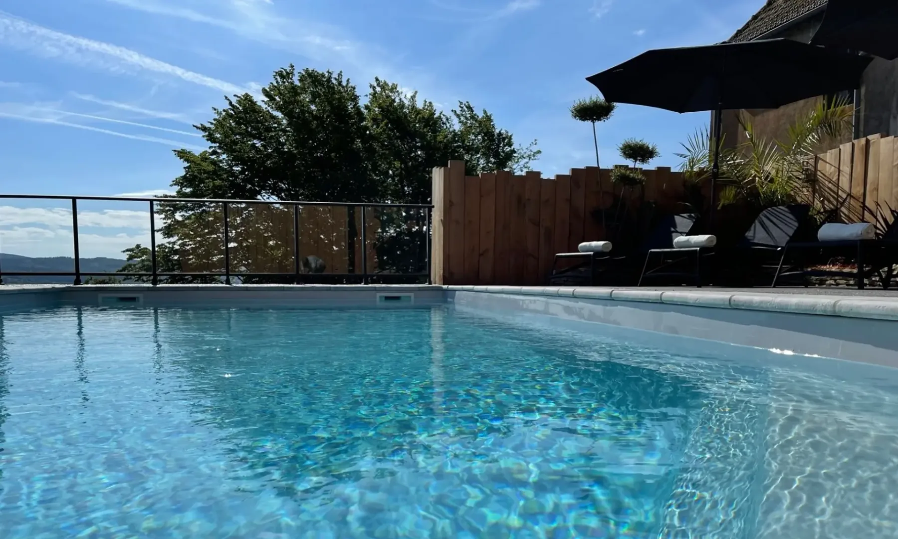 Outdoor pool at Hôtel Au Vieux Morvan